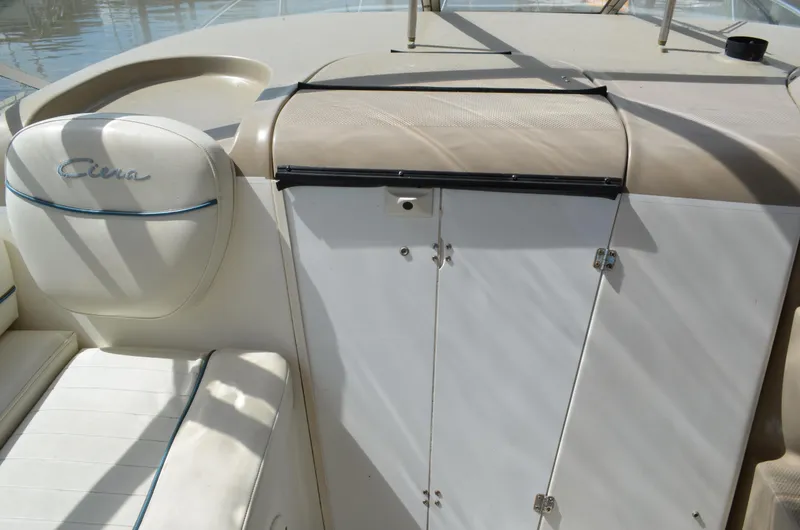 Slide: The Image of 2001 Bayliner 2655 Ciera boat interior with seating and storage compartments. - 14