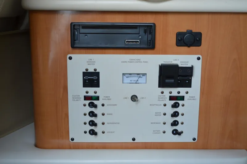 Slide: The Image of Control panel of a 2001 Bayliner 2655 Ciera boat with switches and gauges. - 36