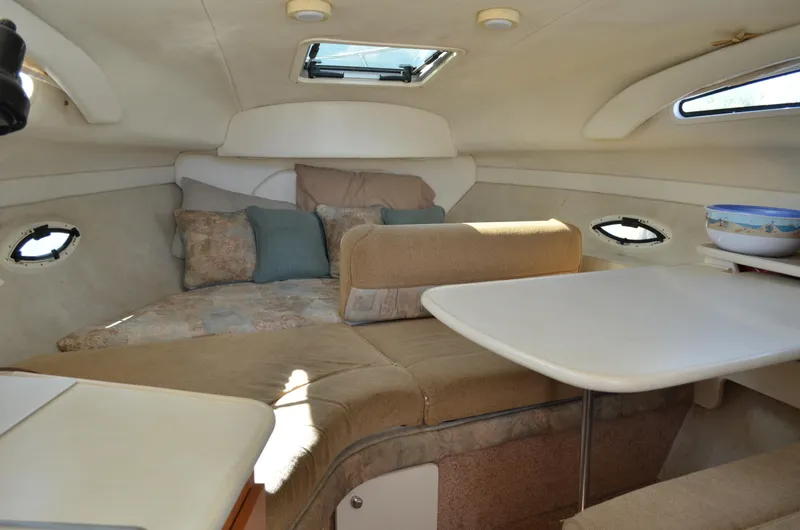 Slide: The Image of 2001 Bayliner 2655 Ciera cabin interior with seating and table. - 40