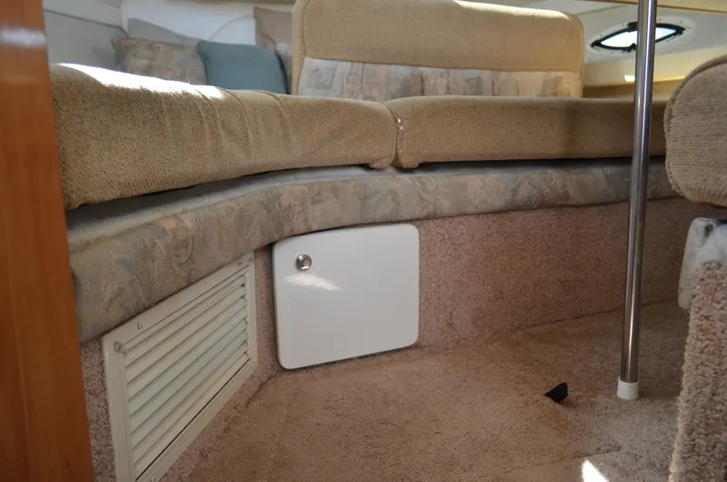 Slide: The Image of Interior of 2001 Bayliner 2655 Ciera boat with beige seating and storage compartment. - 41