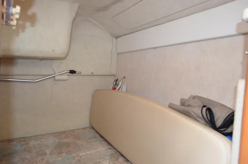 Slide: The Image of 2001 Bayliner 2655 Ciera interior cabin with storage and seating area. - 47