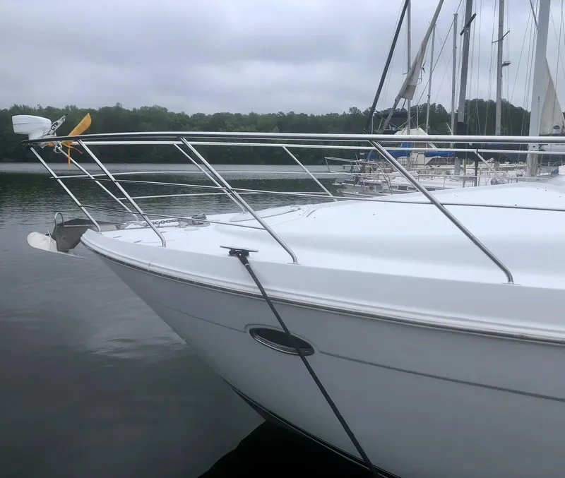 Slide: The Image of 2000 Carver 450 Voyager Pilothouse yacht docked on a calm lake. - 11