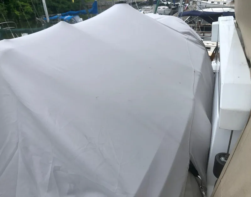 Slide: The Image of Covered 2000 Carver 450 Voyager Pilothouse boat at marina. - 22