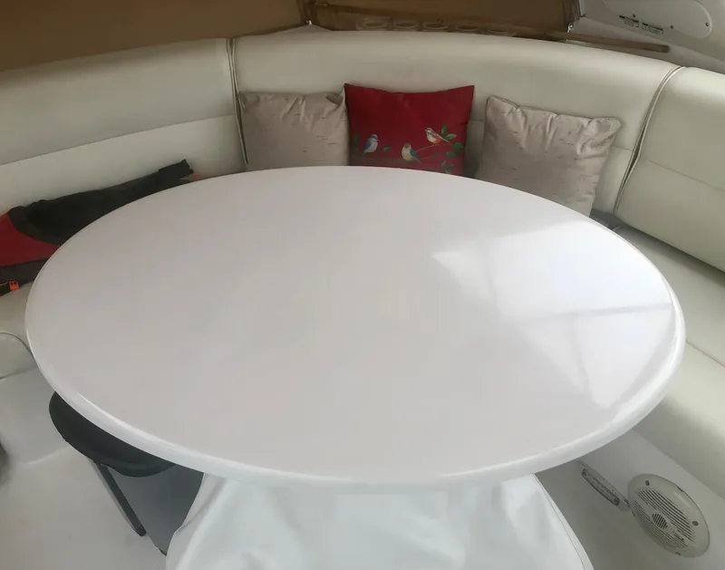 Slide: The Image of Round table with cushions on a Carver 450 Voyager Pilothouse yacht, 2000 model. - 32