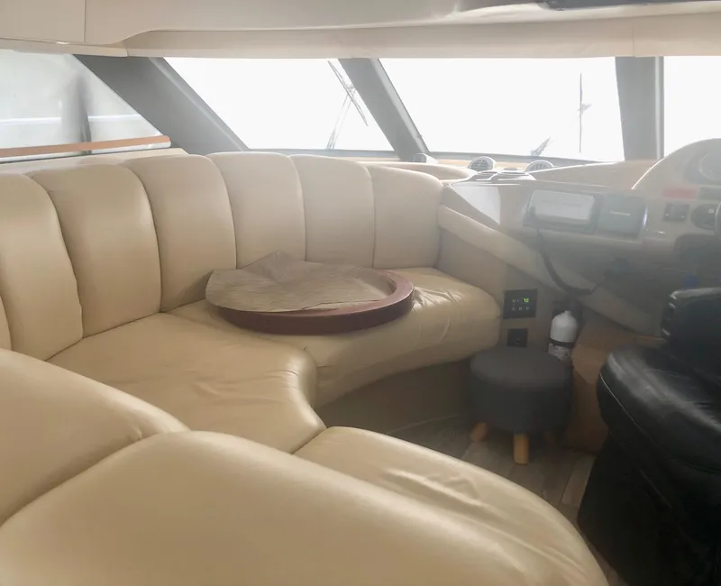 Slide: The Image of Luxurious interior of 2000 Carver 450 Voyager Pilothouse with beige leather seating. - 40