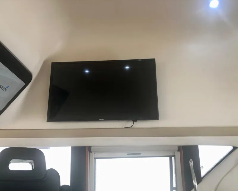 Slide: The Image of Flat-screen TV mounted inside 2000 Carver 450 Voyager Pilothouse yacht. - 43