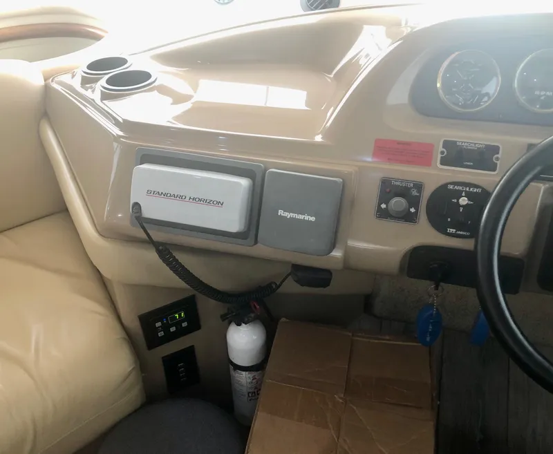 Slide: The Image of Control panel of a 2000 Carver 450 Voyager Pilothouse with navigation equipment. - 45