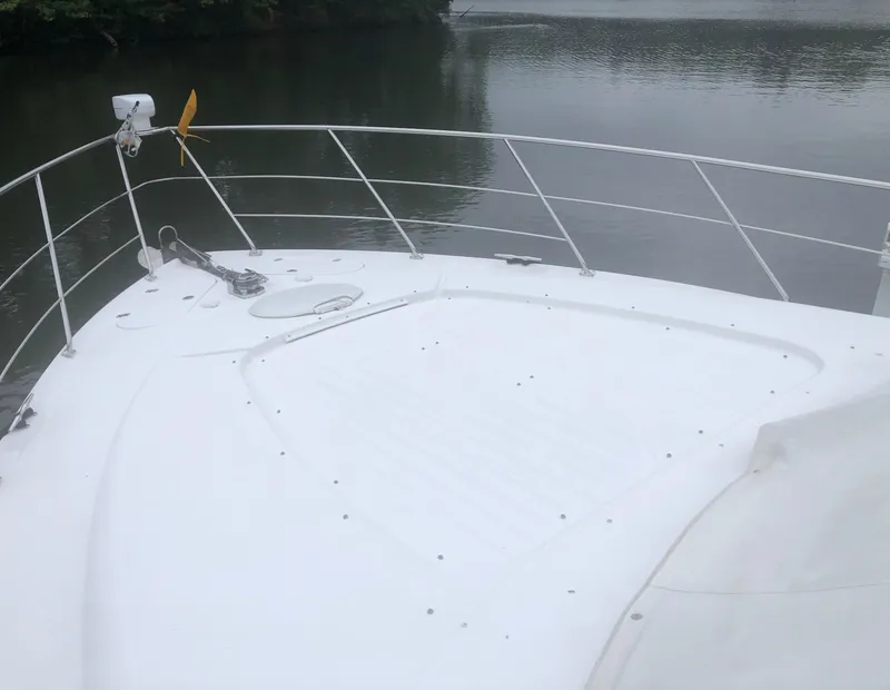 Slide: The Image of Bow of 2000 Carver 450 Voyager Pilothouse yacht on calm water. - 20