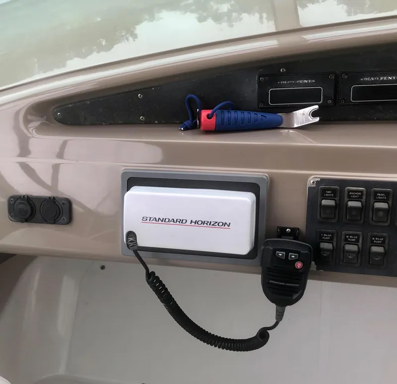 Slide: The Image of Control panel of a 2000 Carver 450 Voyager Pilothouse with Standard Horizon radio. - 27