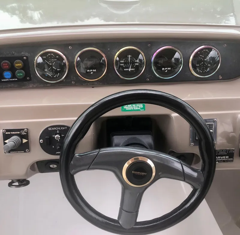 Slide: The Image of Steering wheel and dashboard of a 2000 Carver 450 Voyager Pilothouse boat. - 29
