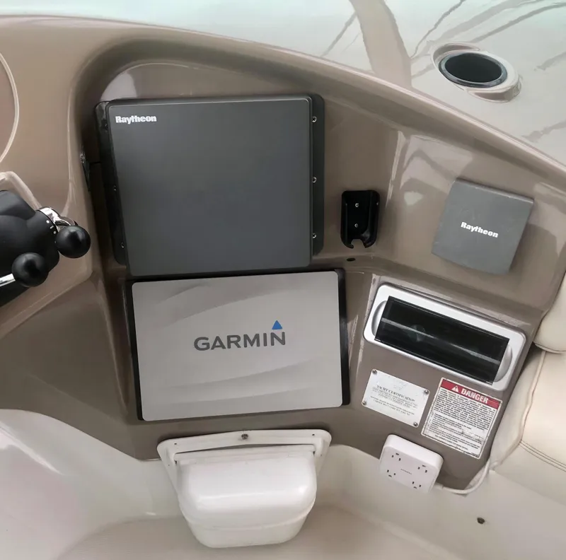 Slide: The Image of Control panel of a 2000 Carver 450 Voyager Pilothouse with Garmin and Raytheon equipment. - 30