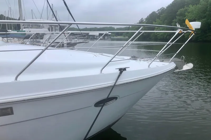 Slide: The Image of 2000 Carver 450 Voyager Pilothouse yacht docked on a calm lake. - 4