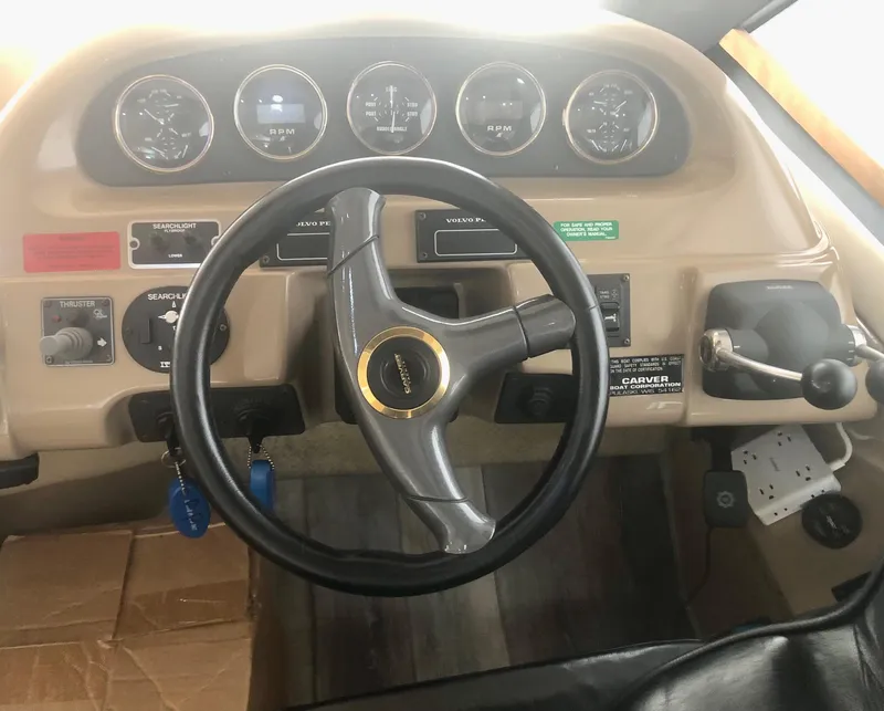 Slide: The Image of Steering wheel and dashboard of a 2000 Carver 450 Voyager Pilothouse yacht. - 44