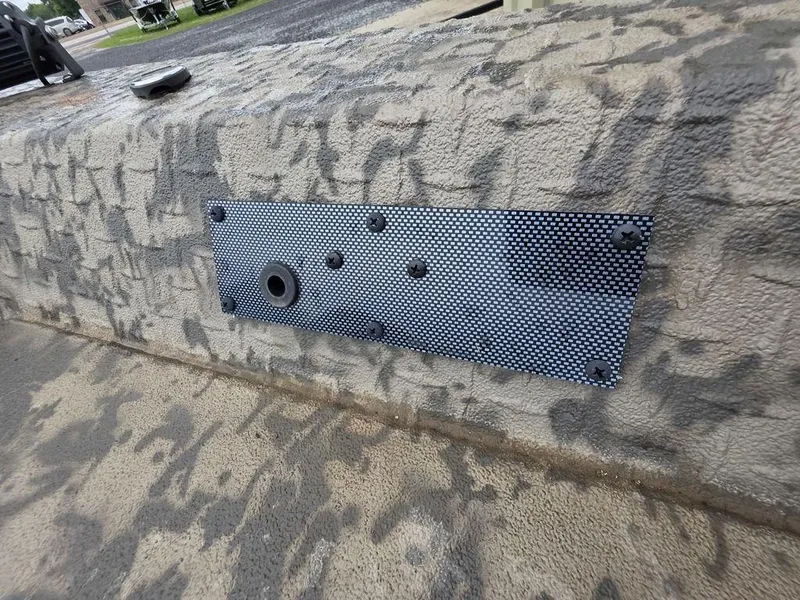 Slide: The Image of Textured surface of 2025 Xpress H18DB boat with metal plate detail. - 2