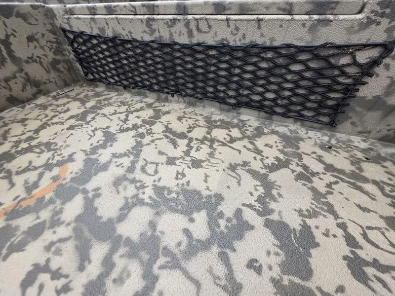 Slide: The Image of Interior of 2025 Xpress H18DB boat with camouflage pattern and storage netting. - 3