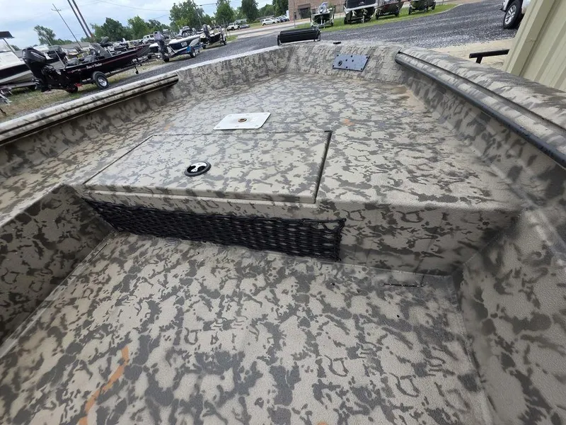 Slide: The Image of 2025 Xpress H18DB boat with camouflage pattern, featuring a spacious deck and storage compartment. - 5