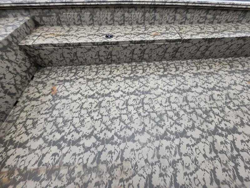 Slide: The Image of 2025 Xpress H18DB boat interior with camouflage pattern design. - 7