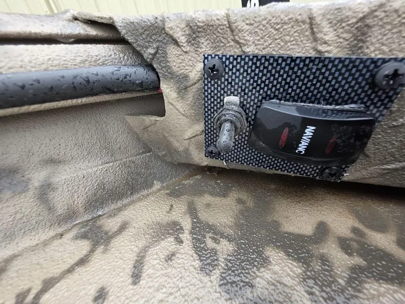 Slide: The Image of Control panel in a 2025 Xpress H18DB boat, featuring a switch and wiring. - 9