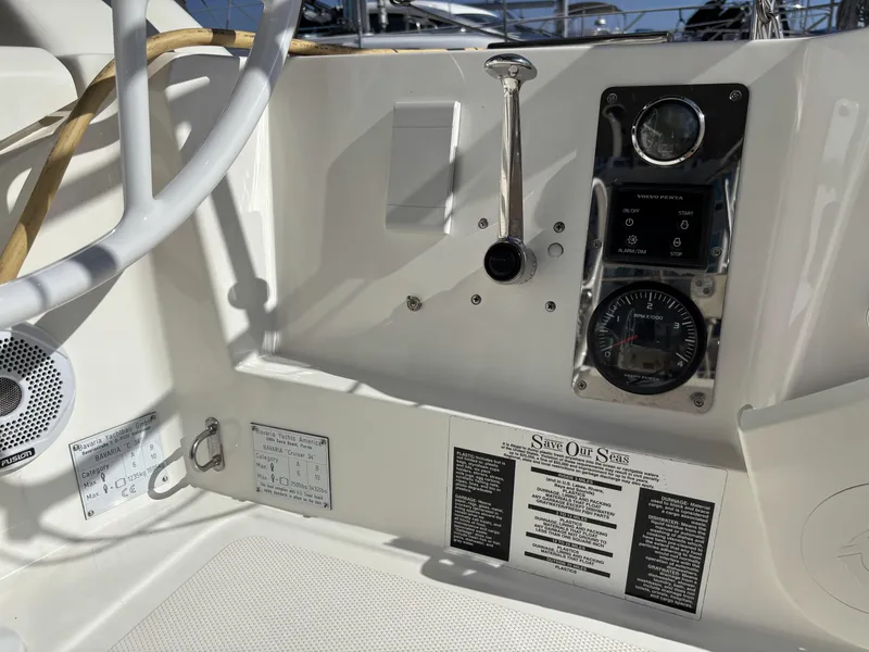 Slide: The Image of Control panel of a 2020 Bavaria Cruiser 34 sailboat, featuring navigation instruments and controls. - 10