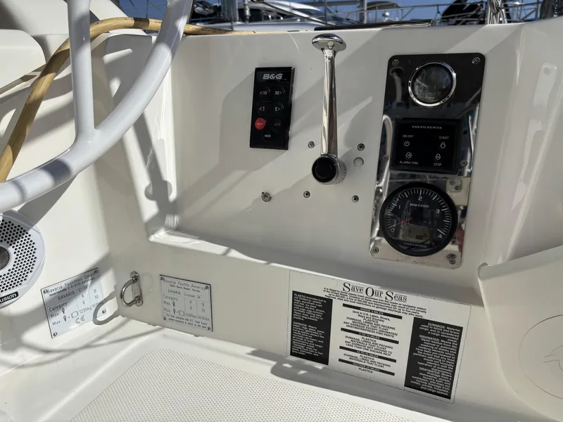 Slide: The Image of Control panel of a 2020 Bavaria Cruiser 34 sailboat, featuring navigation instruments and controls. - 11