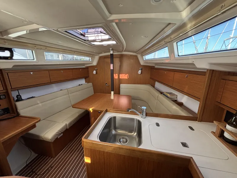Slide: The Image of Interior of 2020 Bavaria Cruiser 34 yacht with modern wood finish and compact kitchen. - 22