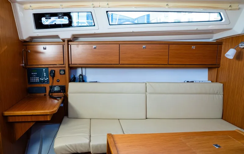 Slide: The Image of Interior of 2020 Bavaria Cruiser 34 yacht with beige seating and wooden cabinetry. - 24