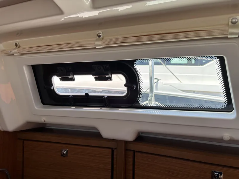 Slide: The Image of Interior view of a 2020 Bavaria Cruiser 34 yacht window and cabinetry. - 28