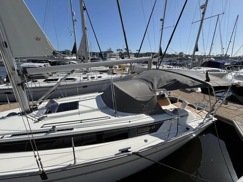 Slide: The Image of 2020 Bavaria Cruiser 34 sailboat docked in a marina under clear blue skies. - 3