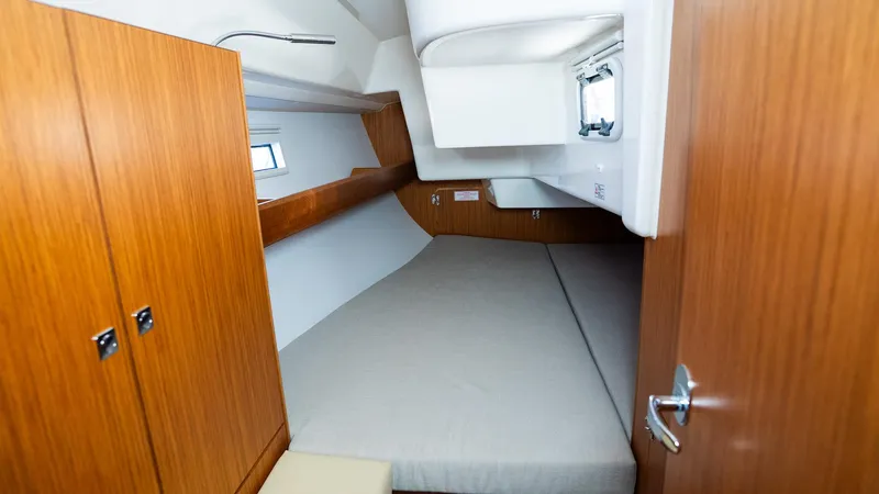 Slide: The Image of Cozy cabin interior of 2020 Bavaria Cruiser 34 yacht with wooden finish and comfortable bed. - 32