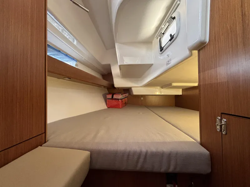 Slide: The Image of Cozy cabin interior of 2020 Bavaria Cruiser 34 sailboat with wooden finish and comfortable bedding. - 33