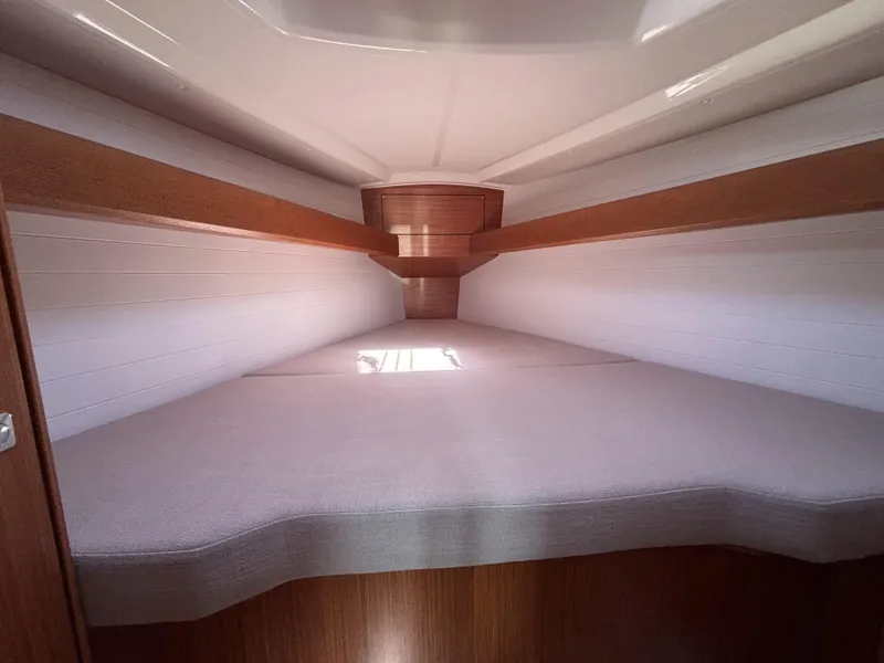 Slide: The Image of Interior cabin of 2020 Bavaria Cruiser 34 yacht, featuring a cozy sleeping area. - 39