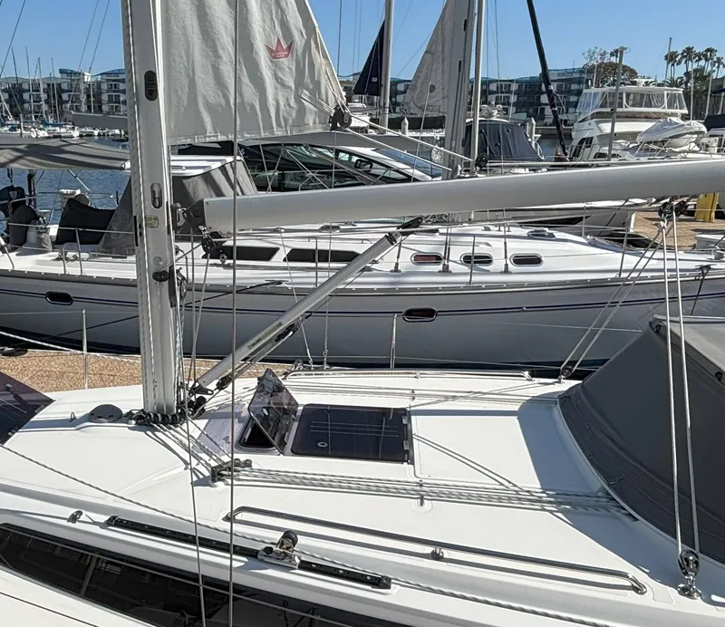 Slide: The Image of 2020 Bavaria Cruiser 34 sailboat docked in a marina, surrounded by other boats. - 4