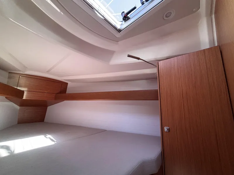Slide: The Image of Interior cabin of 2020 Bavaria Cruiser 34 yacht with wooden finish and overhead hatch. - 41