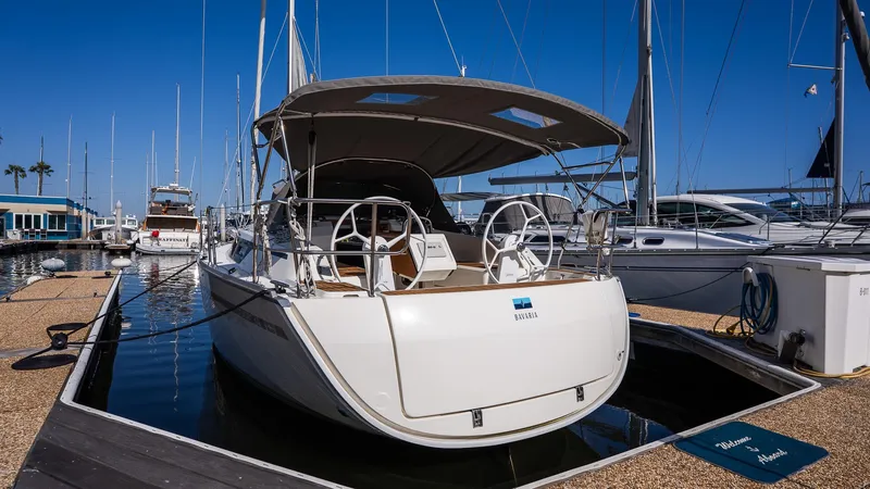 Slide: The Image of 2020 Bavaria Cruiser 34 yacht docked at marina under clear blue sky. - 7