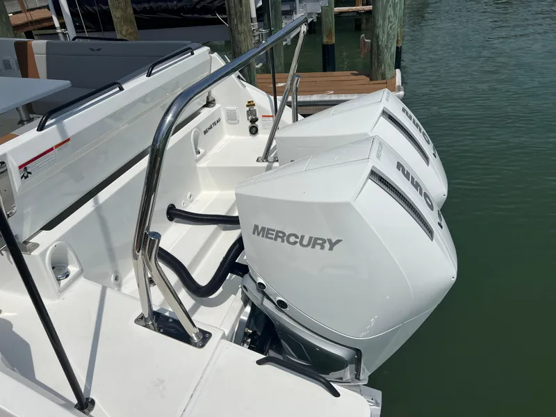 Slide: The Image of 2024 Beneteau Flyer 9 SUNdeck with dual Mercury outboard engines docked. - 10