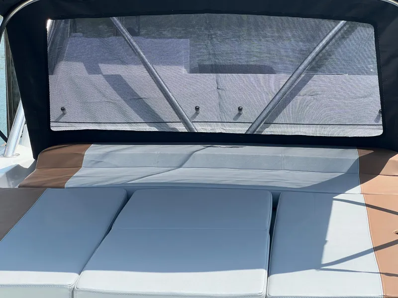 Slide: The Image of 2024 Beneteau Flyer 9 SUNdeck with cushioned seating and protective canopy. - 19