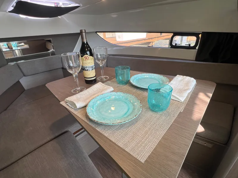 Slide: The Image of 2024 Beneteau Flyer 9 SUNdeck cabin dining area with elegant table setting. - 27