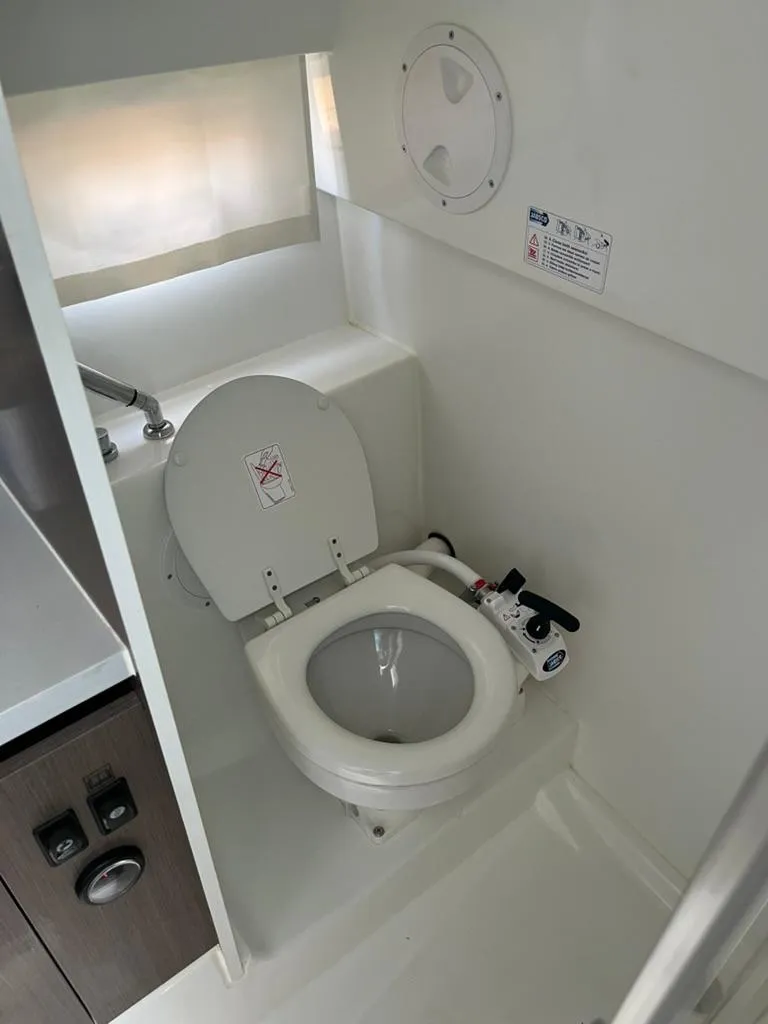 Slide: The Image of 2024 Beneteau Flyer 9 SUNdeck bathroom with compact toilet and sink. - 31