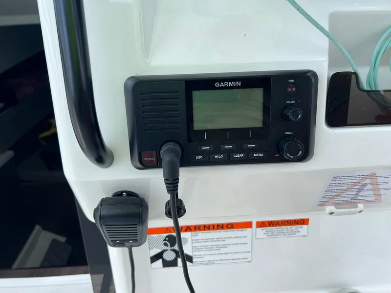 Slide: The Image of Garmin device on 2024 Beneteau 29' Flyer 9 SUNdeck with warning labels visible. - 9