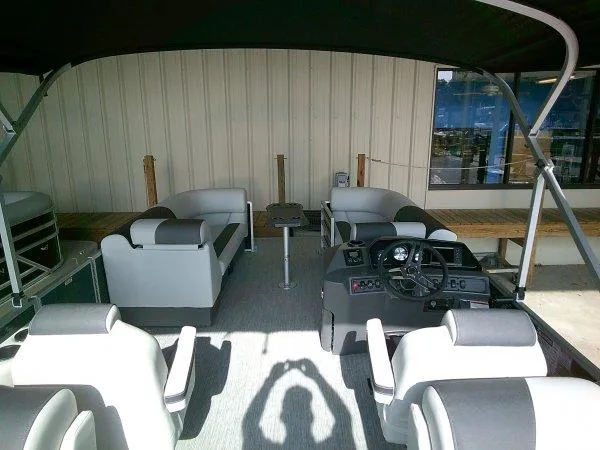 Slide: The Image of 2025 Bennington 22SSR pontoon boat interior with seating and helm station. - 12