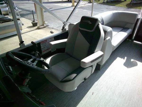 Slide: The Image of 2025 Bennington 22SSR boat interior with modern seating and steering wheel. - 4