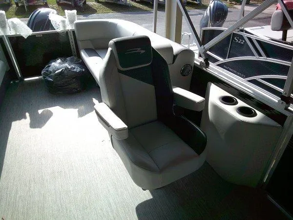 Slide: The Image of 2025 Bennington 22SSR boat interior with plush seating and cup holders. - 6
