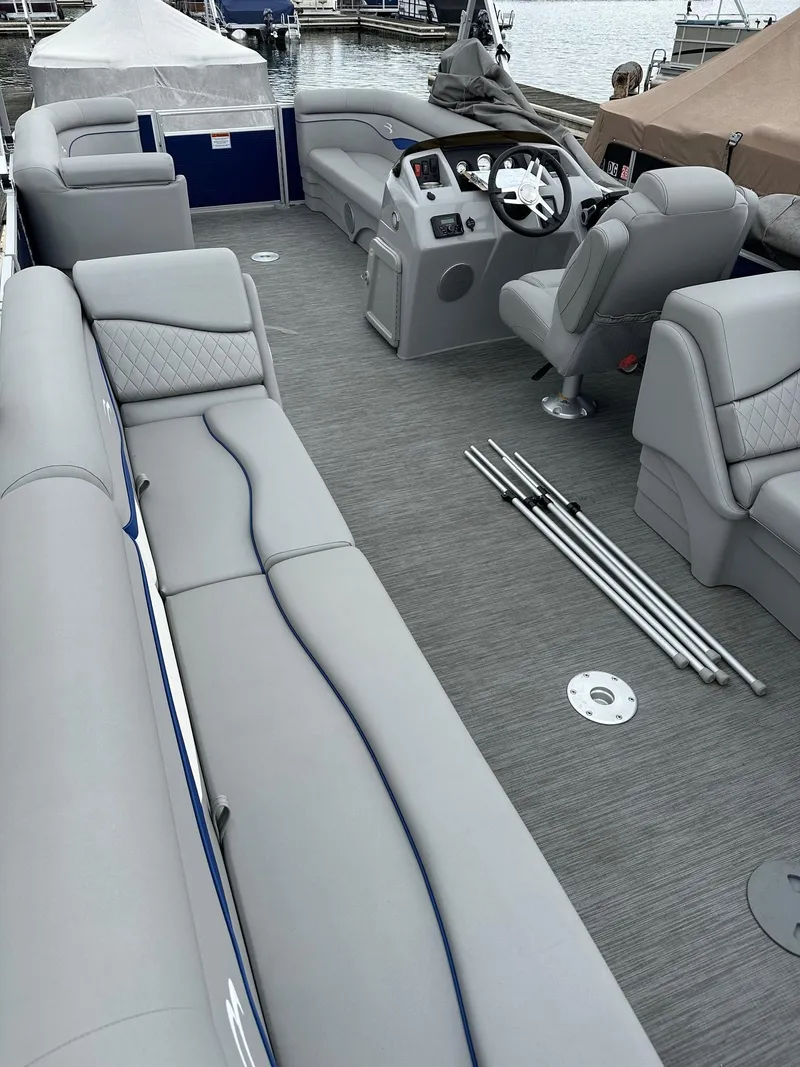 Slide: The Image of 2022 Bennington 24 SSR Quad Bench interior with Yamaha 25Hp, featuring spacious seating and helm. - 12