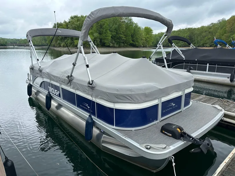 Slide: The Image of 2022 Bennington 24 SSR Quad Bench pontoon with Yamaha 25Hp, docked and covered. - 4