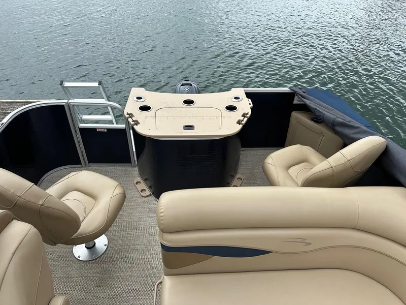 Slide: The Image of 2018 Bennington 20 SSN Family/Fish Pontoon with Yamaha 25Hp, beige seating, on water. - 13