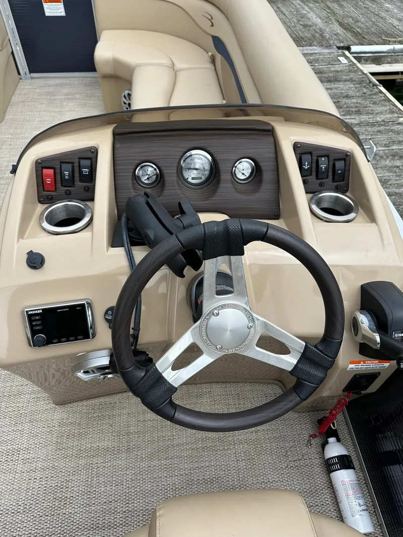 Slide: The Image of 2018 Bennington 20 SSN pontoon boat dashboard with steering wheel and controls. - 15