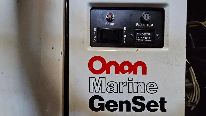 Slide: The Image of Onan Marine GenSet control panel on 1990 Carver 32 Aft Cabin boat. - 33