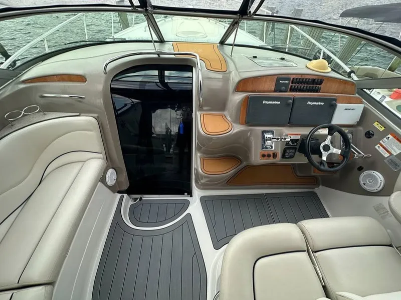 Slide: The Image of 2003 Wellcraft 3700 Martinique boat interior with modern dashboard and seating. - 3