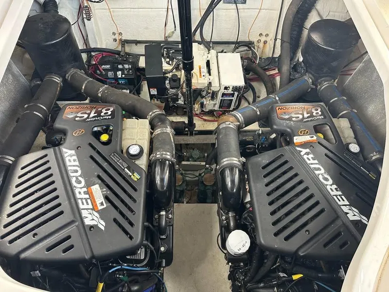 Slide: The Image of Engine room of 2003 Wellcraft 3700 Martinique with twin Mercury 8.1L engines. - 8