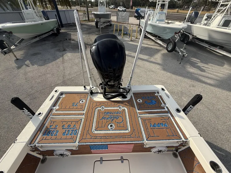 Slide: The Image of 2021 Pathfinder 2400 TRS boat with custom deck design and American flag detail. - 13